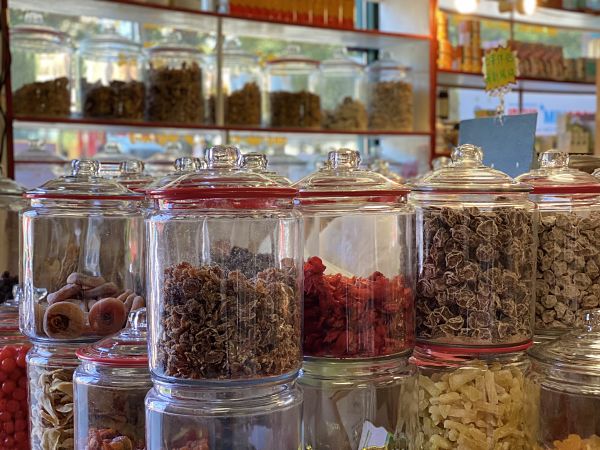 Assorted jars of dried Chinese fruit snacks
