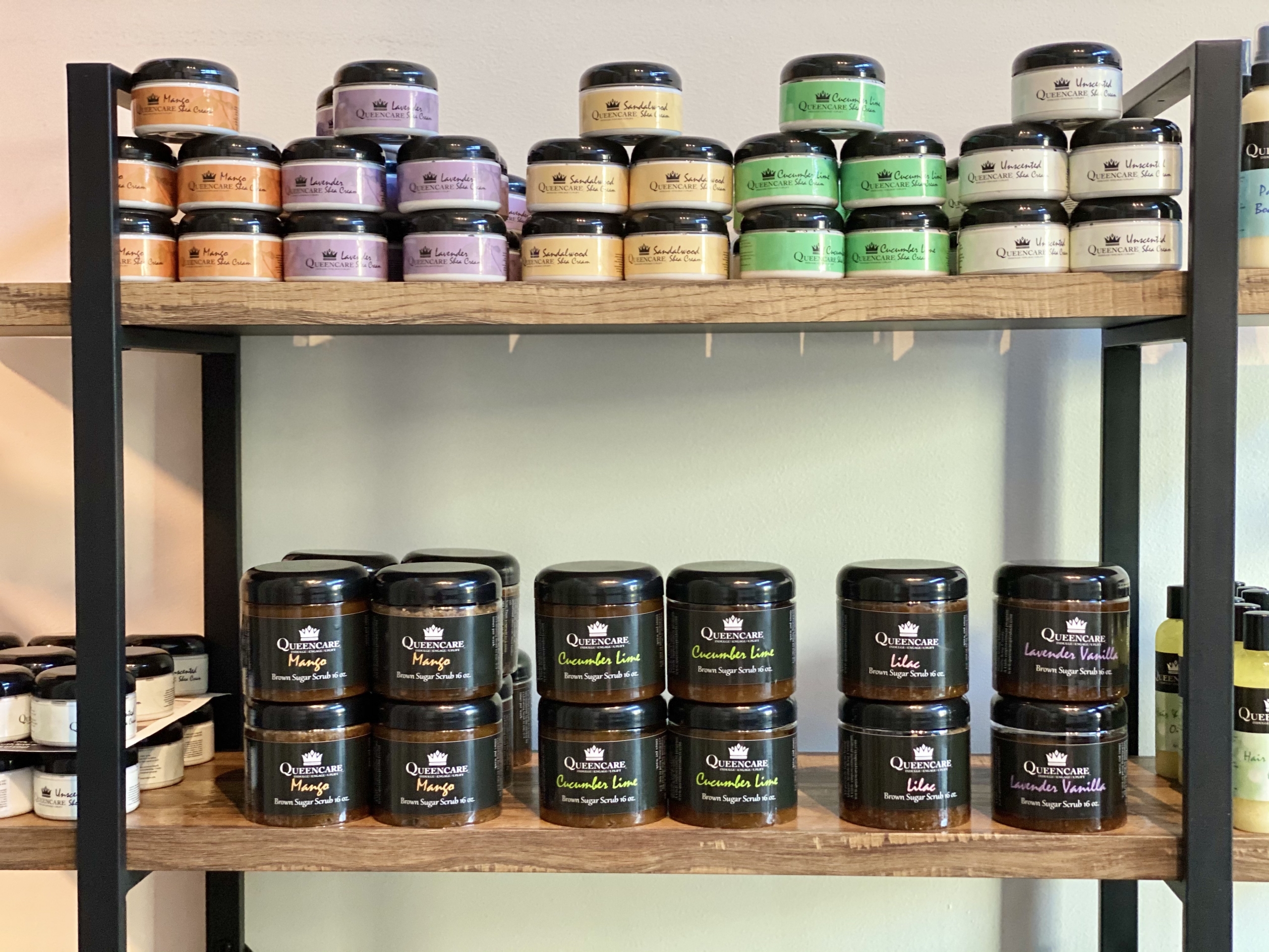 Assorted QueenCare products on a shelf