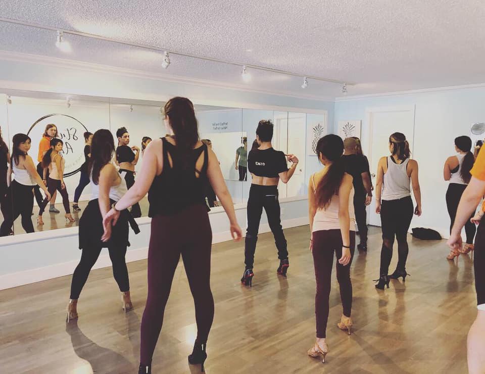 Dance class facing mirror.