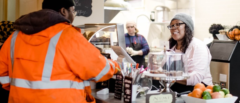 Customer and business owner at register