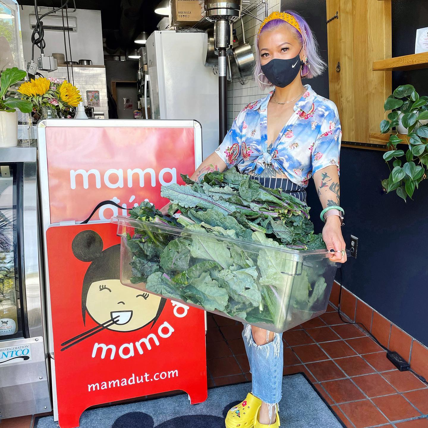 Founder Thuy Pham outside restaurant